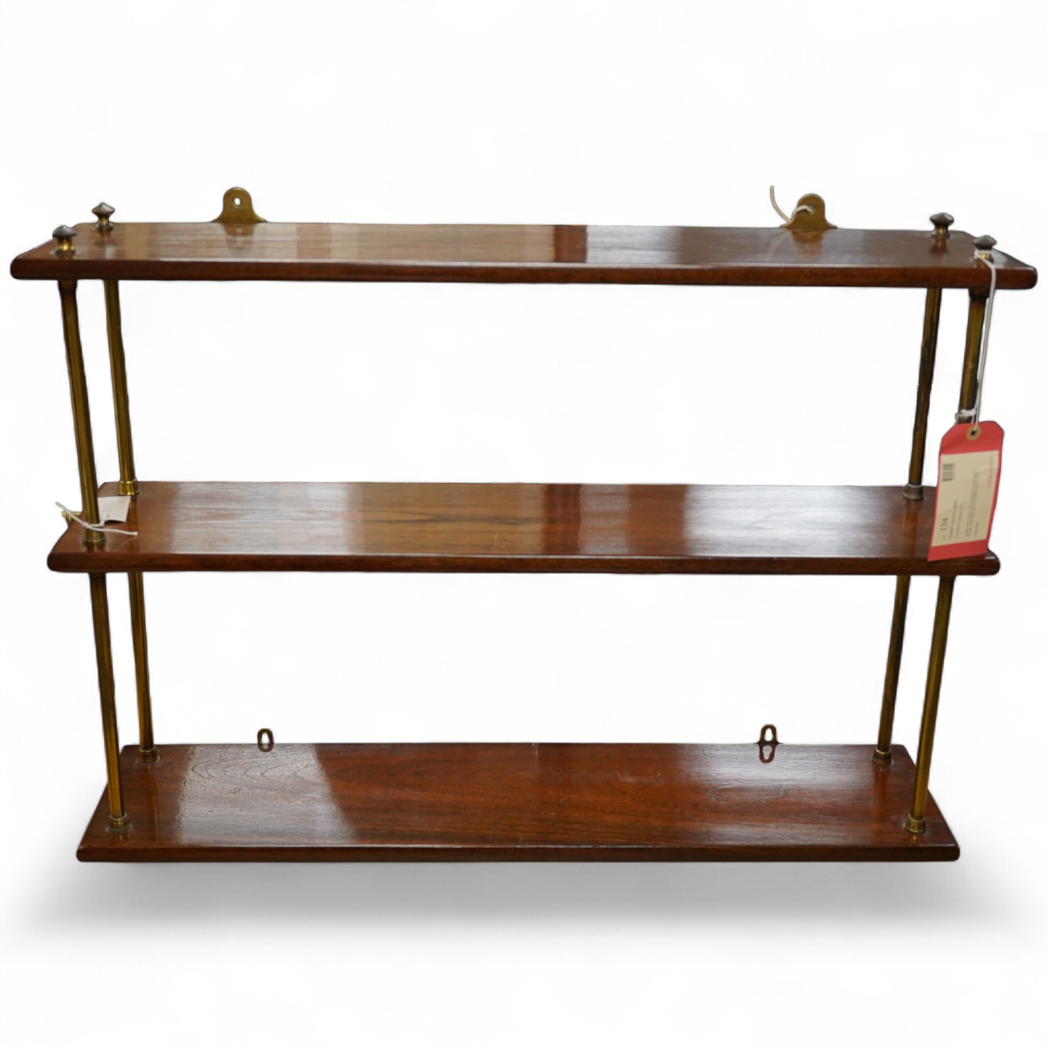 A set of 19th century teak and gilt brass campaign hanging shelves, 57cm high